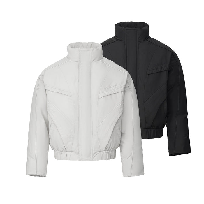 White and black cropped puffer bomber jackets shown together from the front, with stand collars and geometric seam details