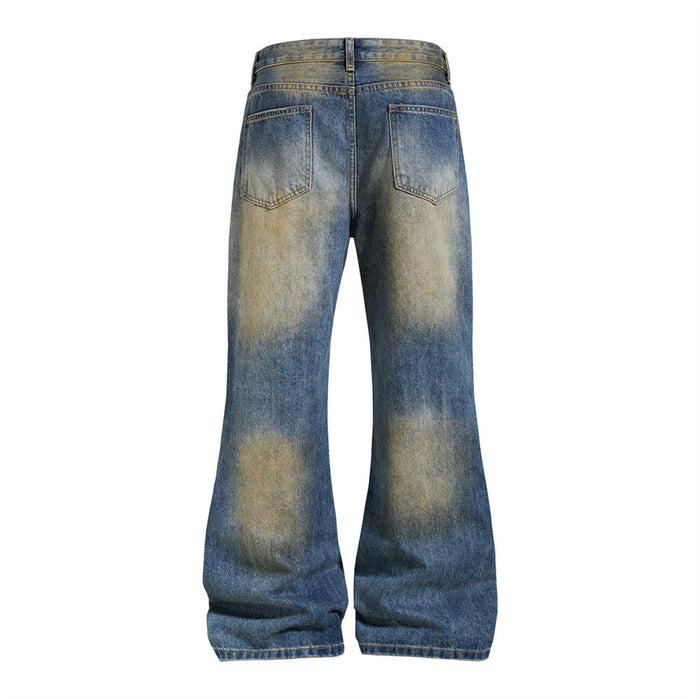 Flat back view of blue wide-leg jeans with tan faded patches, two rear pockets, belt loops, and flared hems