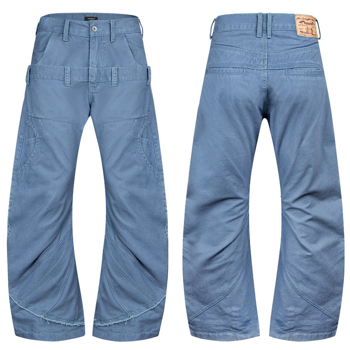 Men's steel blue wide-leg pants with double waistband, curved seam paneling, and raw frayed hem, front and back view