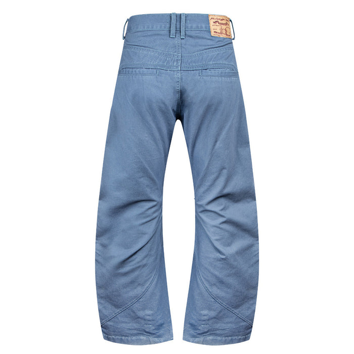 Back view of blue wide-leg pants with a double waistband, curved lower-leg seams, and plain rear panels