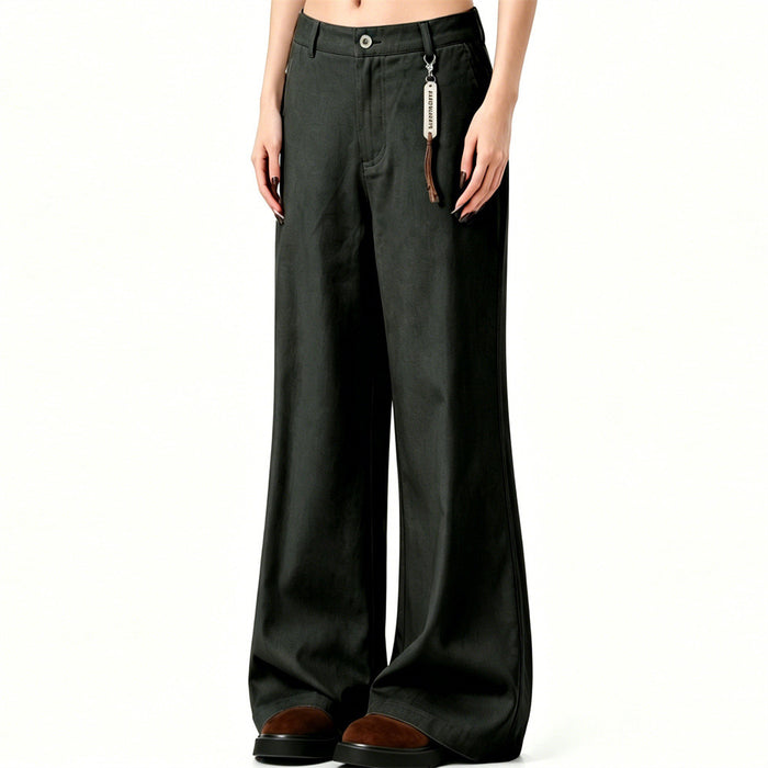 Dark green flared trousers shown on a model from an angled front view with a hanging tag and wide hems
