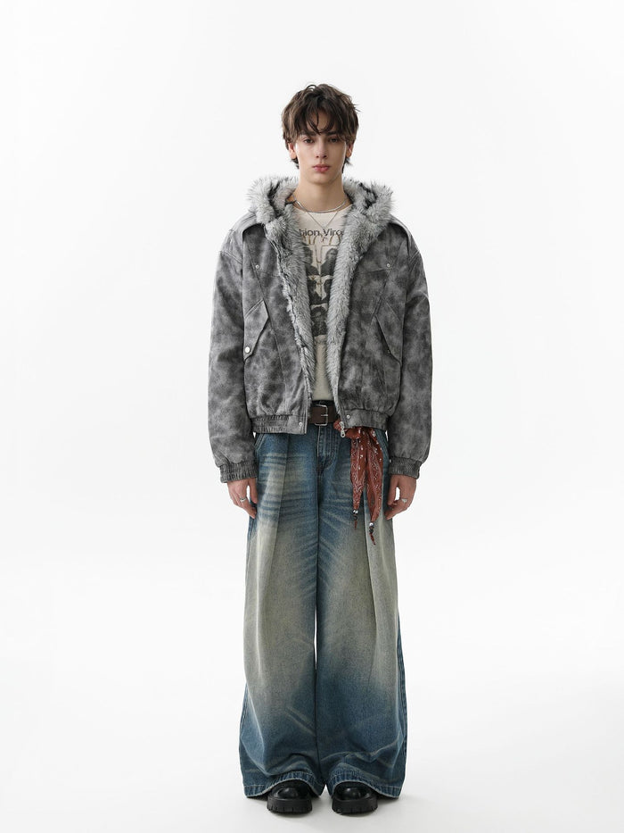 Model wearing a grey faux-fur hooded bomber jacket with a front zipper and plush hood trim