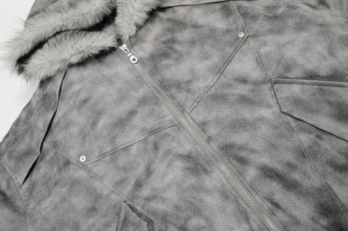 Close-up of the grey bomber jacket front showing the plush hood trim, zipper, and flap pockets