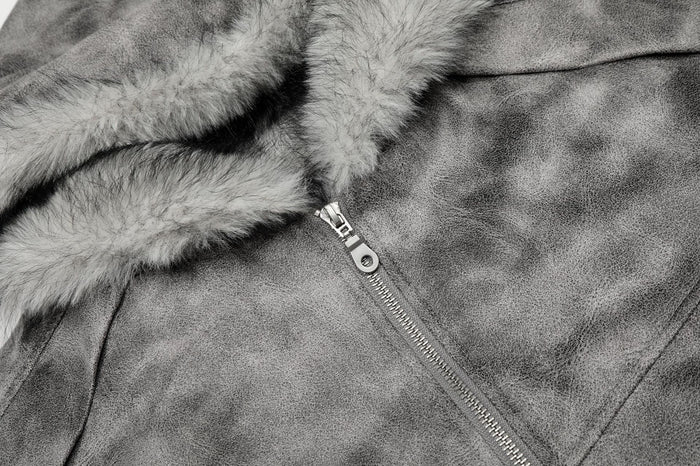 Close-up of the jacket zipper and soft grey faux-fur hood trim