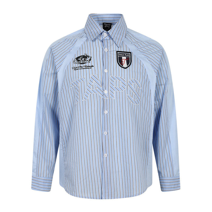 Men's light blue vertical pinstripe long-sleeve button-down shirt with embroidered lettering and shield badge patch, front an