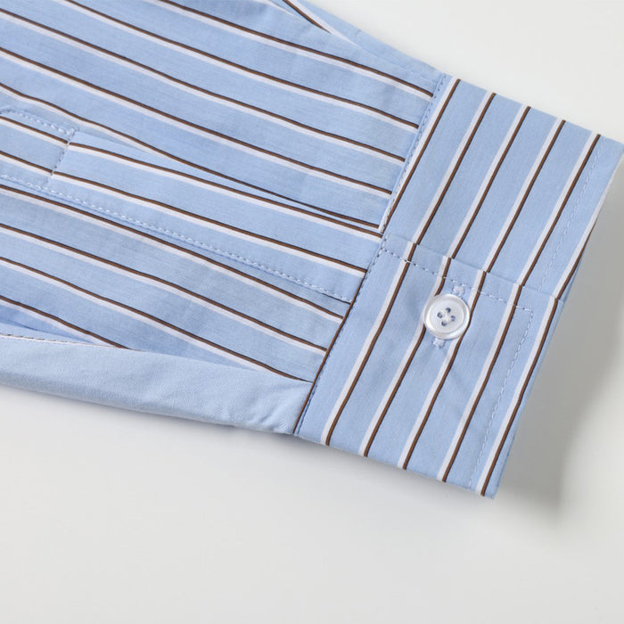 Close-up of the striped shirt sleeve cuff with button closure and neat edge stitching