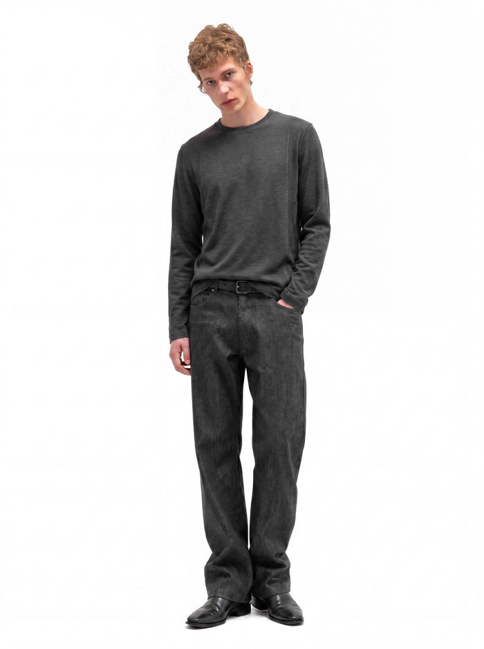 Full-length view of a man wearing a charcoal gray relaxed-fit long-sleeve crew neck shirt