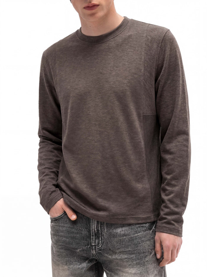 Close front view of a man wearing a brown long-sleeve crew neck shirt