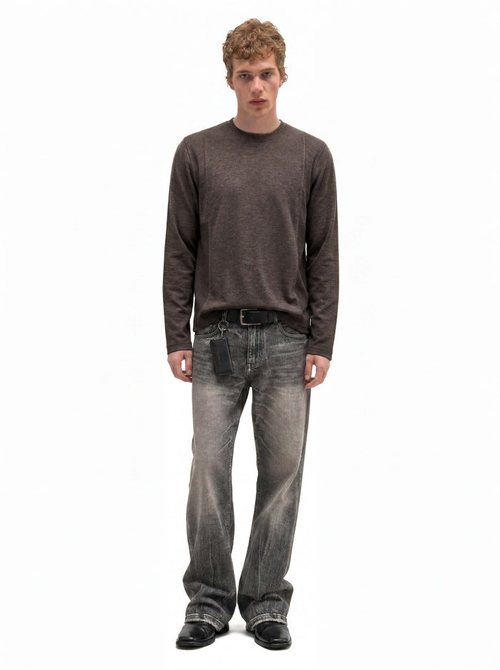Full-length front view of a man wearing a brown long-sleeve crew neck shirt