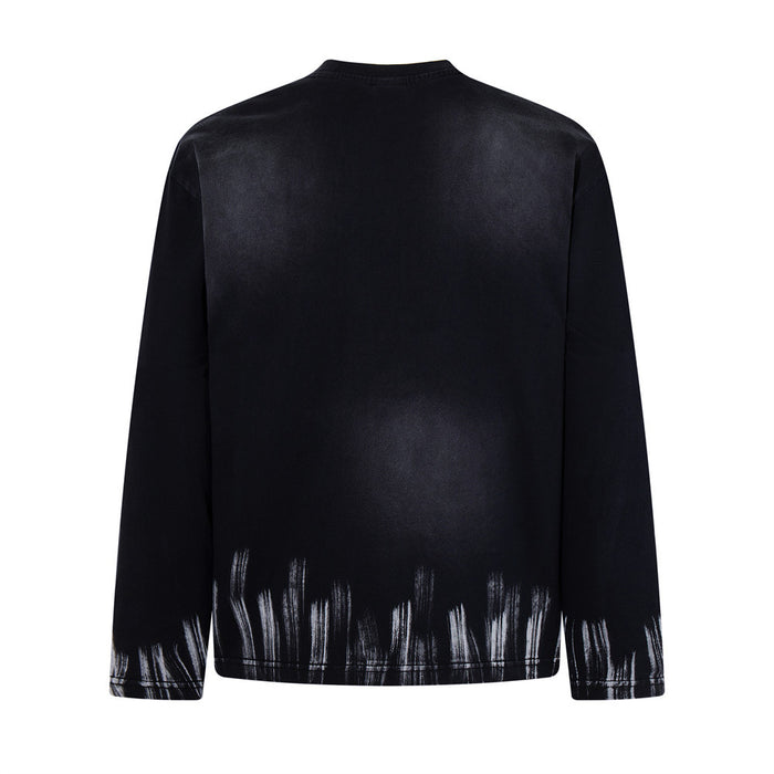 Back view of the black long-sleeve shirt with subtle spray-dye shading and distressed white streaks at the hem and cuffs