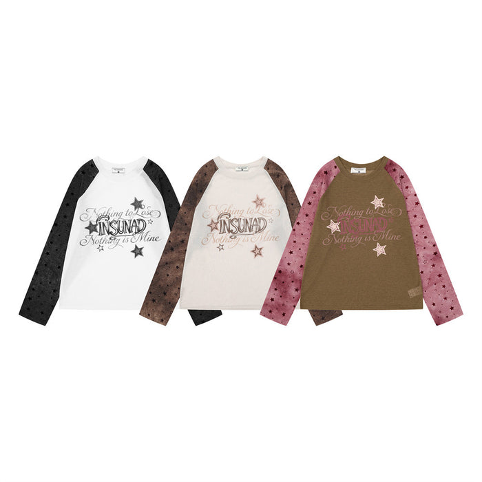 Three raglan long sleeve shirts in white, cream, and brown with star-print sleeves and graphic fronts