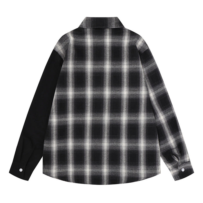 Back view of the gray-black plaid shirt showing the full plaid pattern, black left sleeve, collar, and buttoned cuffs