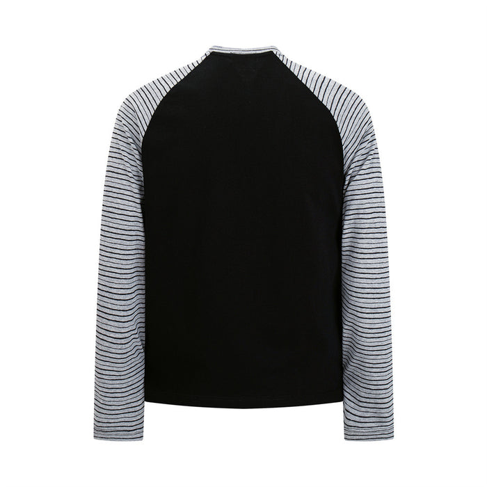 Front view of a black raglan long-sleeve tee with light striped sleeves and a plain black body