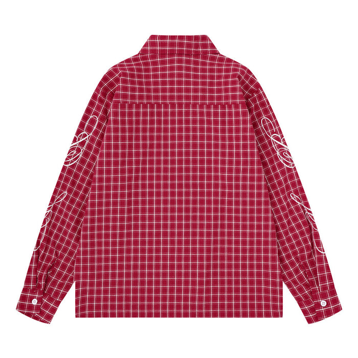Back view of a red plaid long-sleeve button-up shirt with white graphic details on both sleeves