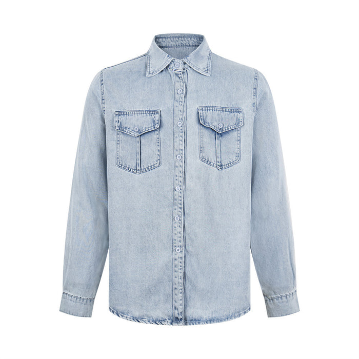 Light wash denim shirt front with pointed collar, button placket, long sleeves, and two flap chest pockets