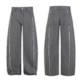 Black and white vertically striped wide-leg jeans shown front and back with frayed deconstructed seams