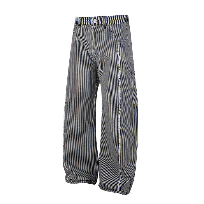 Angled front view of black and white striped wide-leg jeans with long loose legs and frayed seams