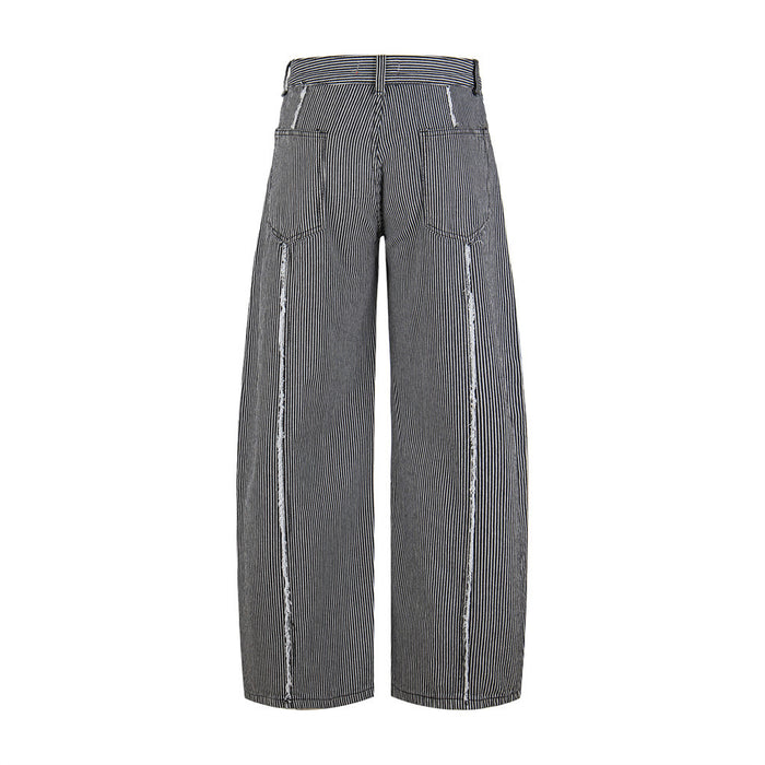 Back view of black and white striped wide-leg jeans with patch pockets and frayed outer seams