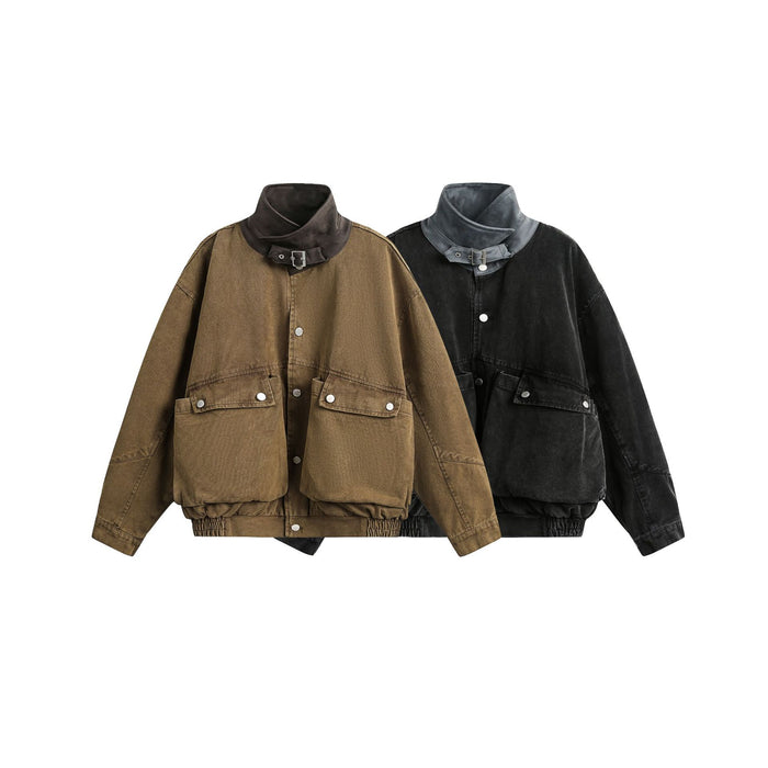 Brown and black washed canvas bomber jackets shown together from the front with buckle collars and cargo pockets