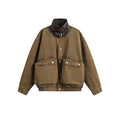Men's oversized washed canvas bomber jacket with large cargo pockets and buckle stand collar in tan brown and washed black