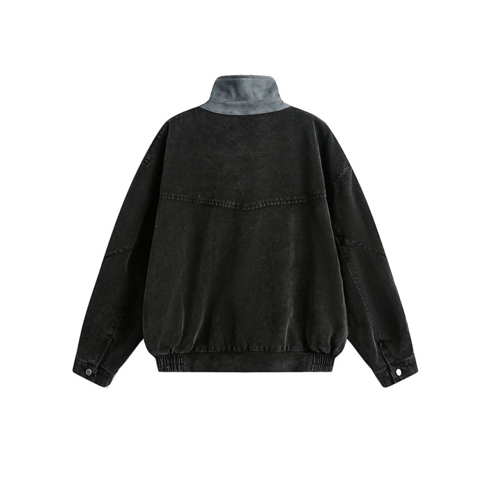 Black washed canvas bomber jacket shown from the back with a high collar, stitched panels, and elastic hem