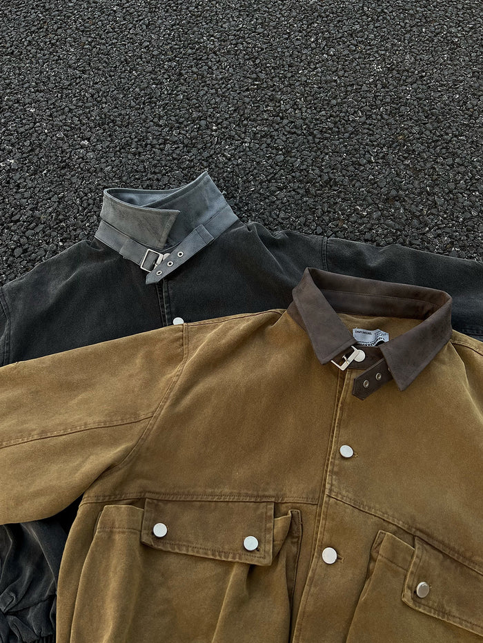Close view of brown and black bomber jacket collars, snap fronts, and large flap cargo pockets