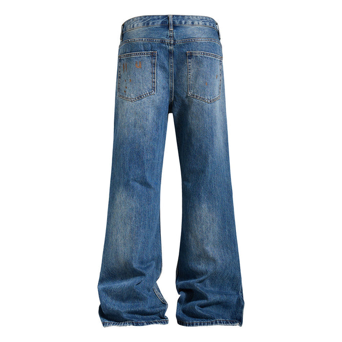 Back view of blue flare jeans with two rear pockets, faded denim, and lightly distressed hems