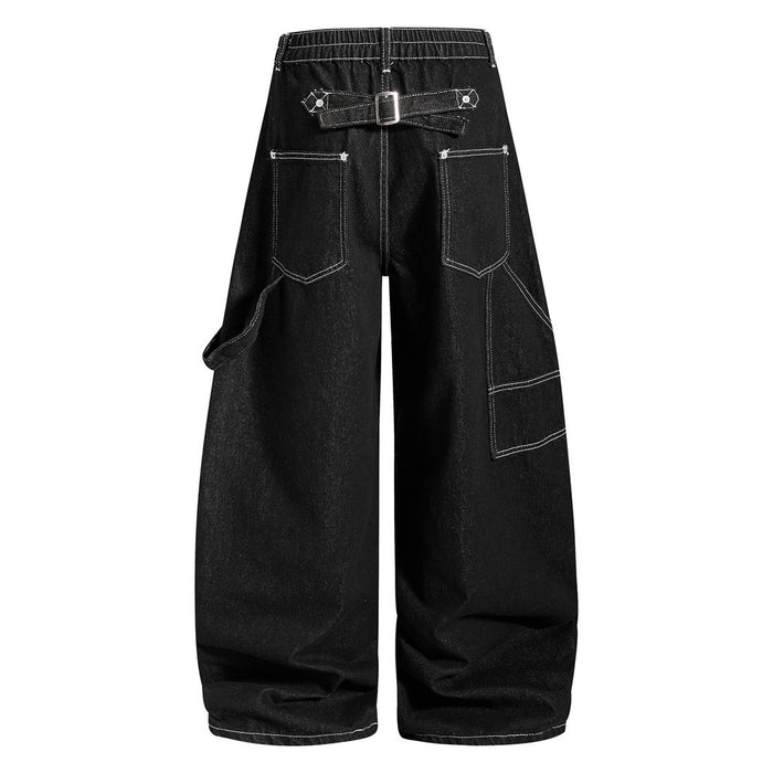 Back view of black wide-leg cargo jeans with a buckle waistband, outlined rear pockets and side cargo pockets