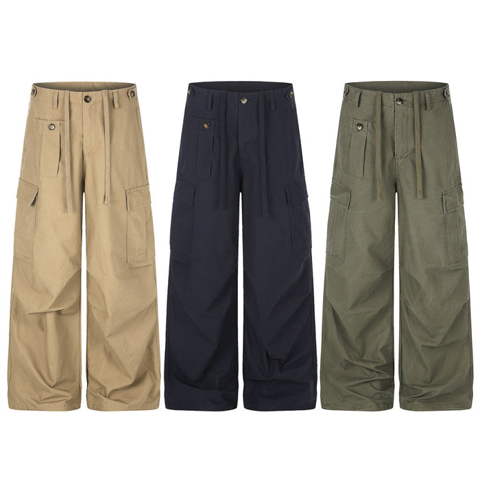 Men's loose wide-leg cargo pants in navy with multi-pocket utility design and front pleats