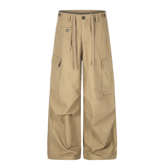 Front view of khaki wide-leg cargo pants with drawstring waist, multiple pockets, and straight hems
