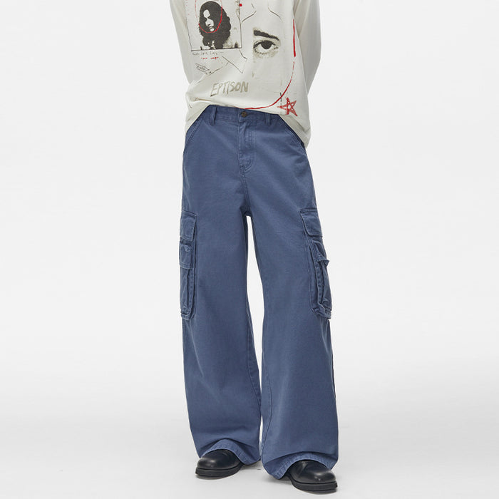 Men's wide-leg washed cargo pants in blue with large flap pockets and straight-leg silhouette