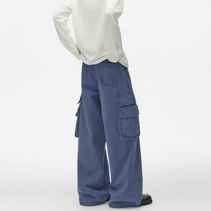 Rear angled view of blue cargo pants showing back pockets, side pockets, and wide straight legs