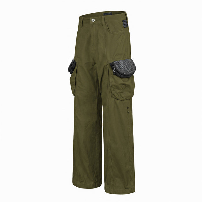 Olive green cargo pants in an angled front view showing wide legs, layered side pockets, and patterned pocket flaps