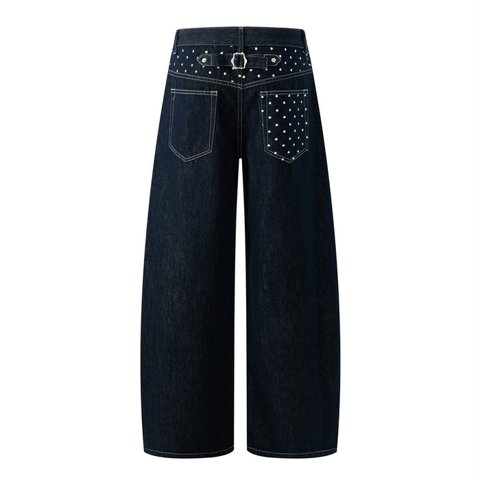 Back view of dark indigo wide-leg jeans with star-patterned pocket, belt detail, and contrasting stitching