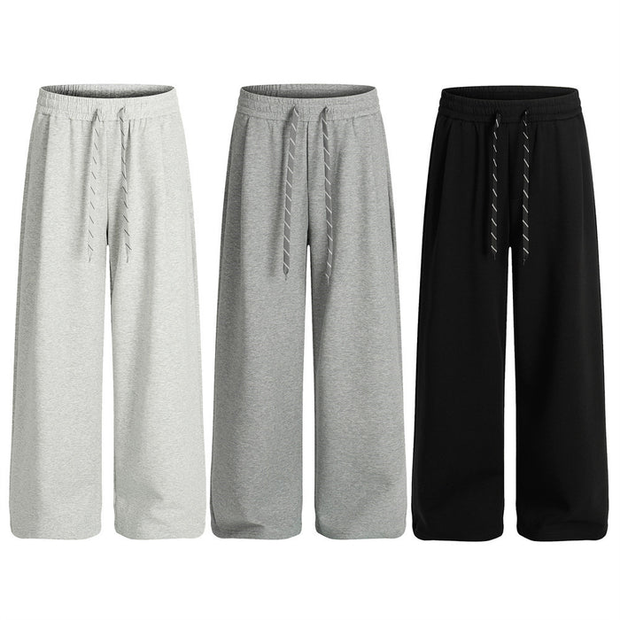 Men's wide-leg loose fit sweatpants with elastic drawstring waist in black, shown front and side view