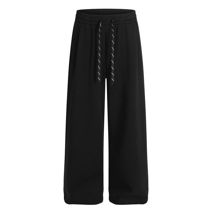 Black wide-leg sweatpants shown from the front with an elastic waistband and contrasting drawstrings