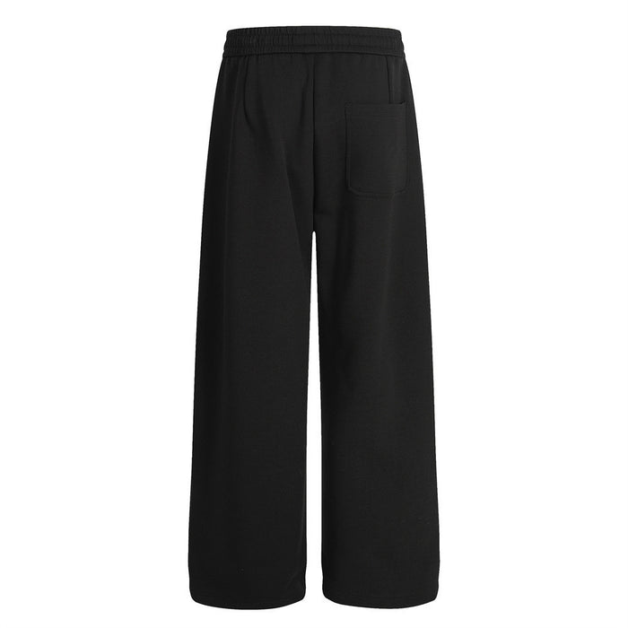 Black wide-leg sweatpants shown from the back with a single rectangular rear pocket