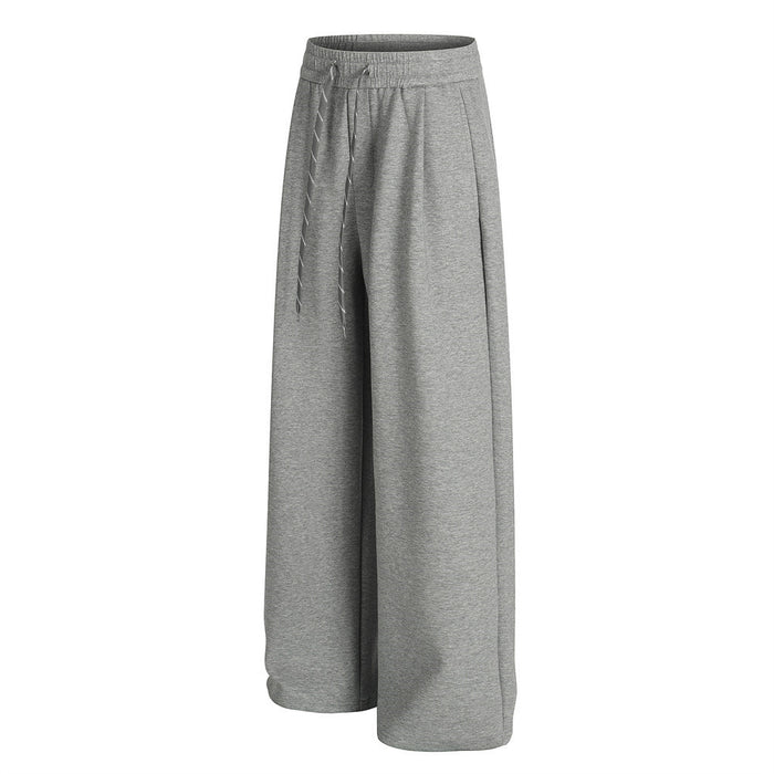 Heather gray wide-leg sweatpants shown from a side angle with wide legs and front drawstrings