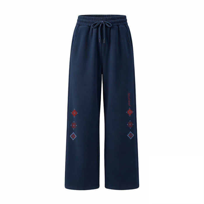 Navy wide-leg sweatpants front view with drawstring waist and red, blue, and gray geometric leg motifs