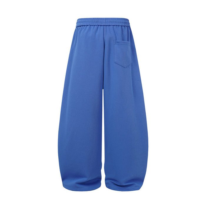 Back view of blue wide-leg sweatpants showing the elastic waistband and single rear pocket