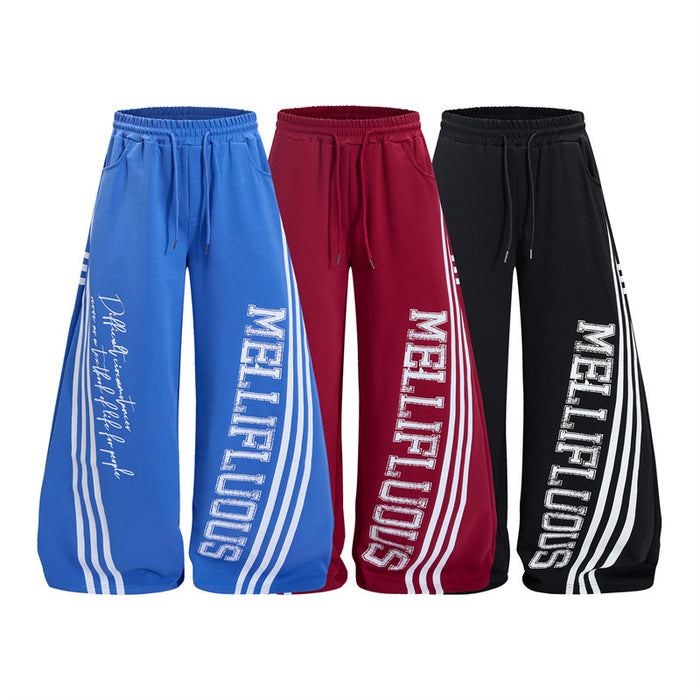 Wide-leg sweatpants in blue, burgundy, and black with triple white stripes and MELLIFLUOUS lettering