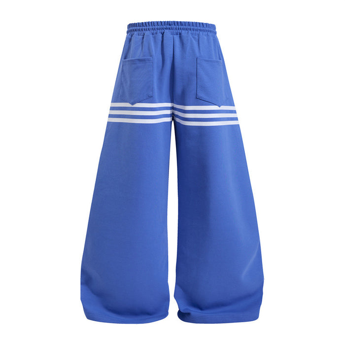 Blue wide-leg sweatpants shown from the back with two pockets and triple white stripe bands