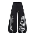 Black wide-leg sweatpants front with triple white side stripes, MELLIFLUOUS lettering, and cursive text