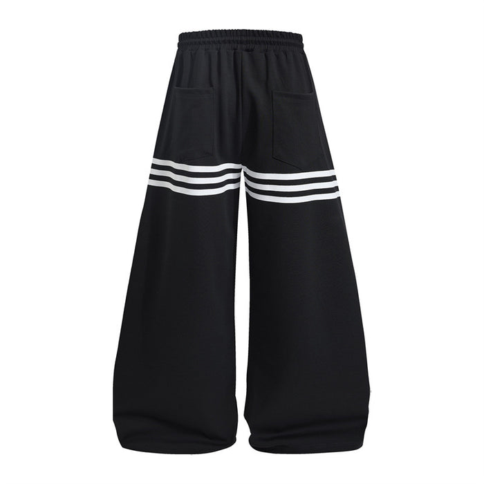 Black wide-leg sweatpants back with two pockets and triple white stripe bands across the legs