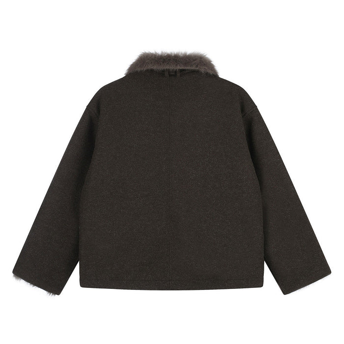 Back view of the dark brown oversized jacket showing a plain back, long sleeves, and faux fur collar