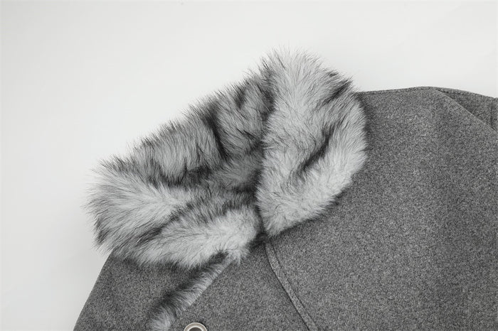 Close-up of the gray jacket's plush faux fur collar and textured outer fabric