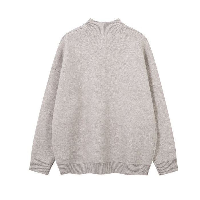 Back view of a light gray knit mock-neck sweater showing its plain knit design and ribbed hem