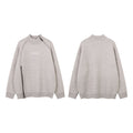 Light gray knit sweater shown in front and back views, featuring a diagonal zipper and ribbed trim
