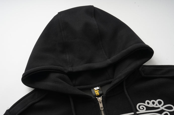 Close-up of the black hood, neckline, and upper silver zipper on the hooded jacket