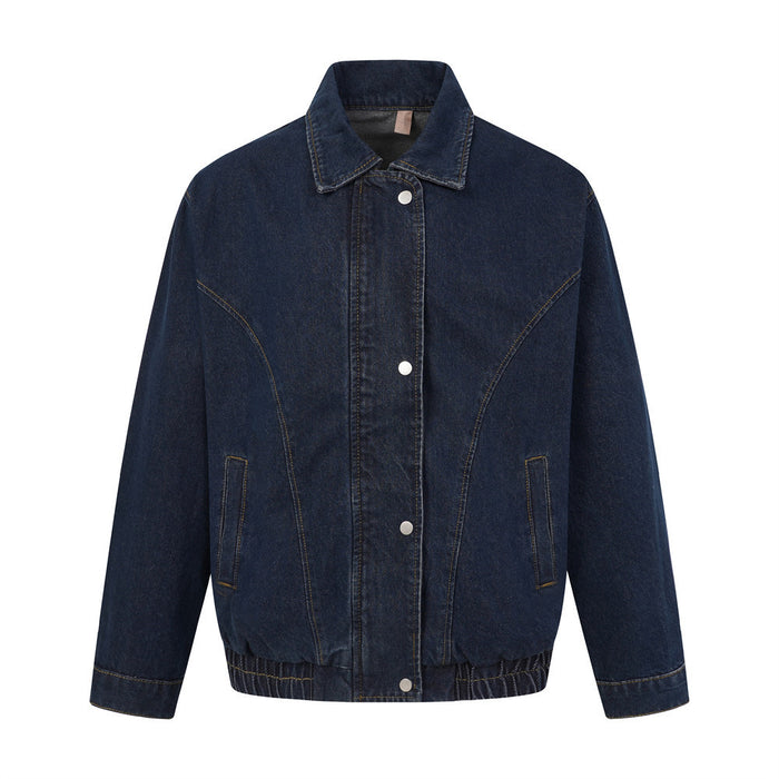 Oversized dark indigo denim jacket with spread collar, snap-button front, curved chest seams, and elastic ribbed hem, shown f